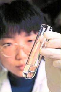 a scientist holding a test tube
