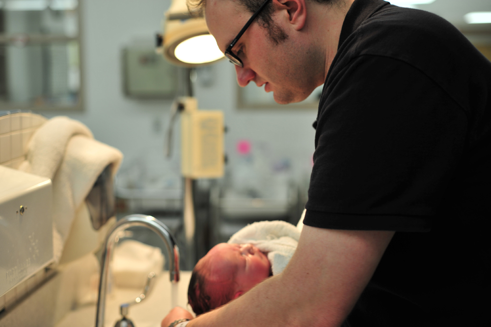 A man and a baby.