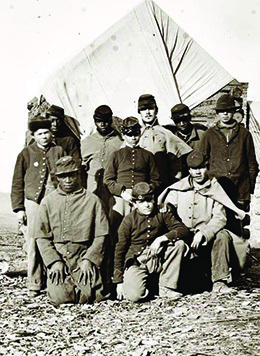 A photograph shows a small group of casually posed black and white Union soldiers.