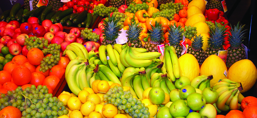 A photograph of different types of fruit at a market.
