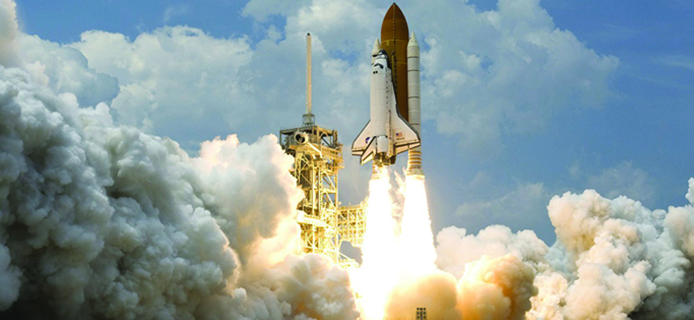 This is an image of a space shuttle blasting off into space.
