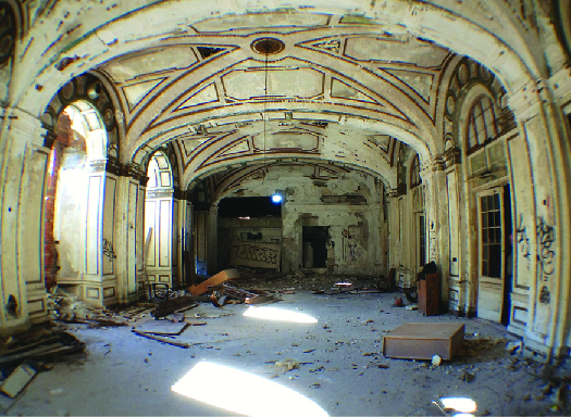 An image of the inside of a dilapidated building.