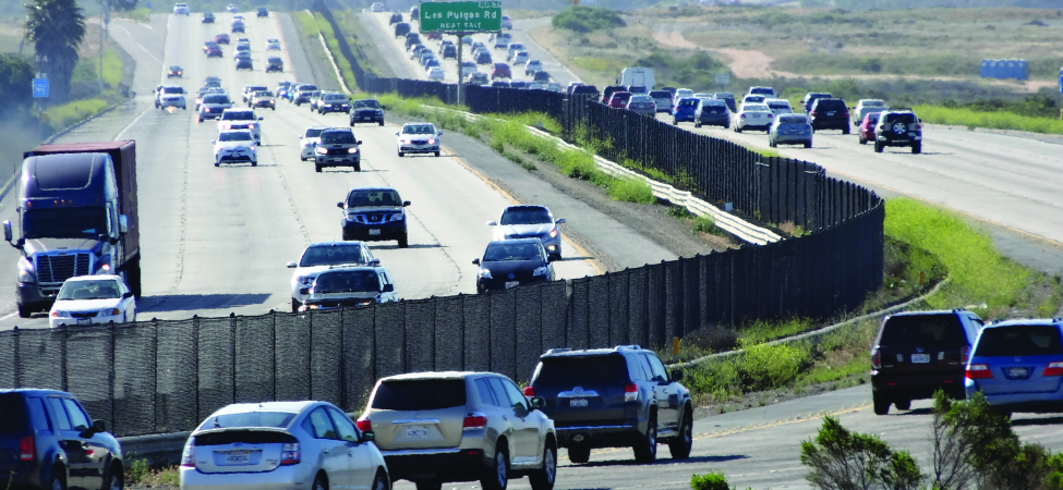 A photo of cars on the highway.